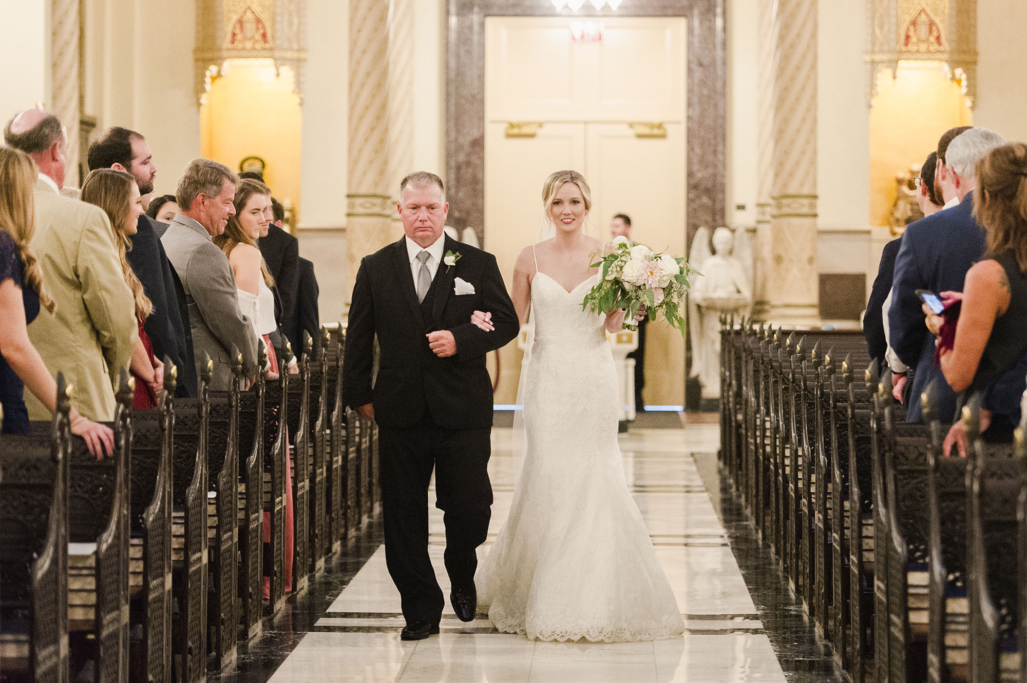 Bride and father walking down aisle
