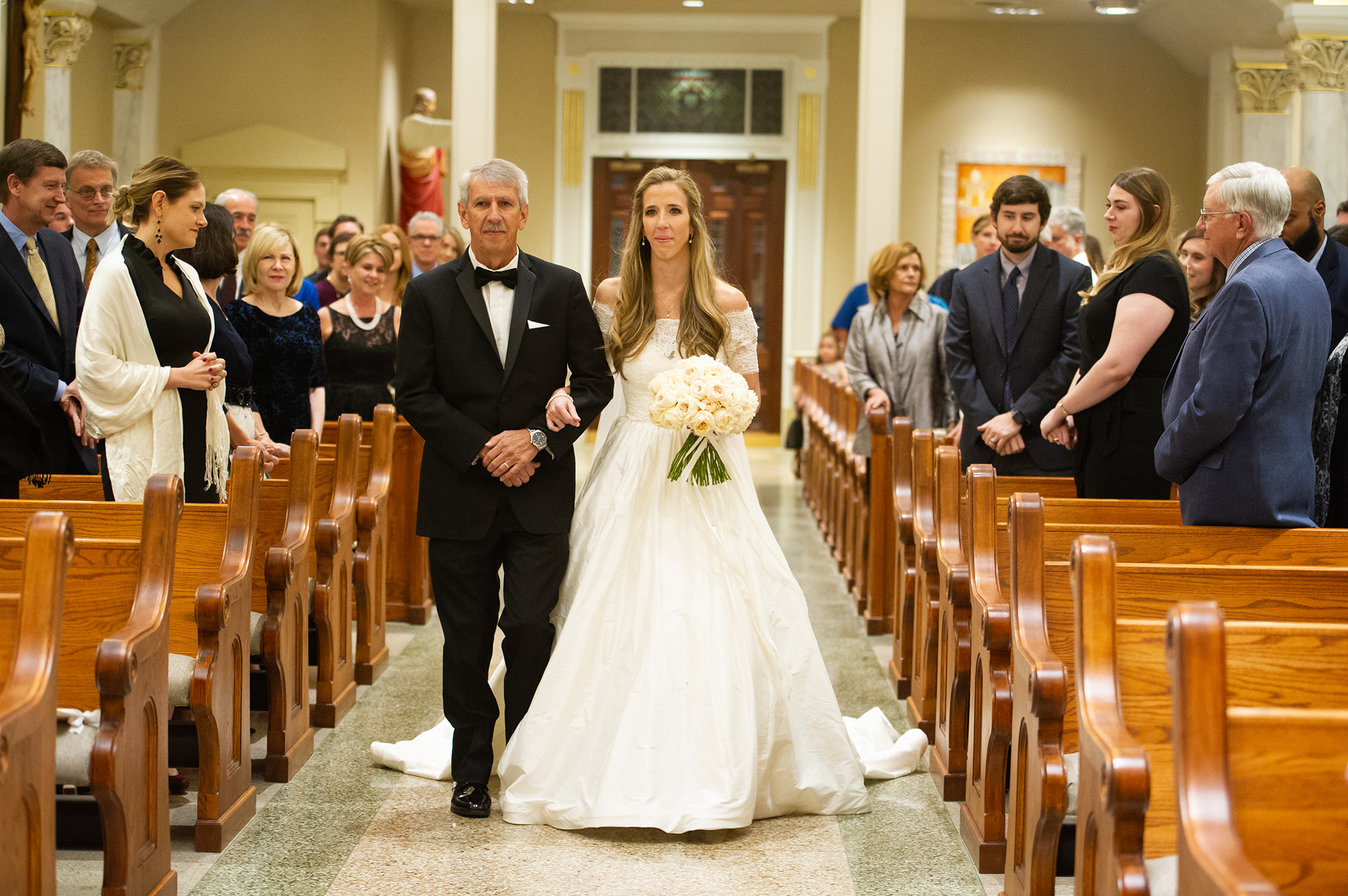 Bride walking down aisle with dad
