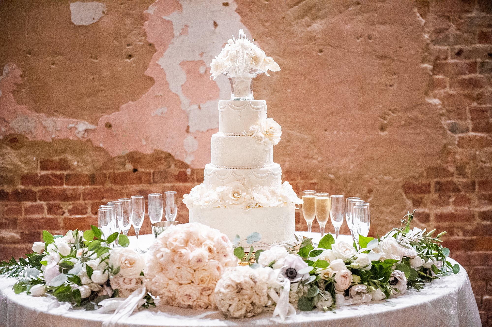 Wedding cake with flowers and champagne