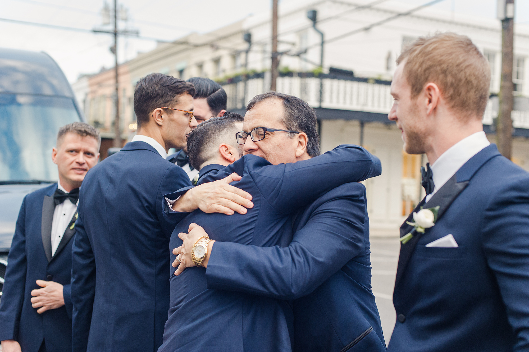groomsmen hugging