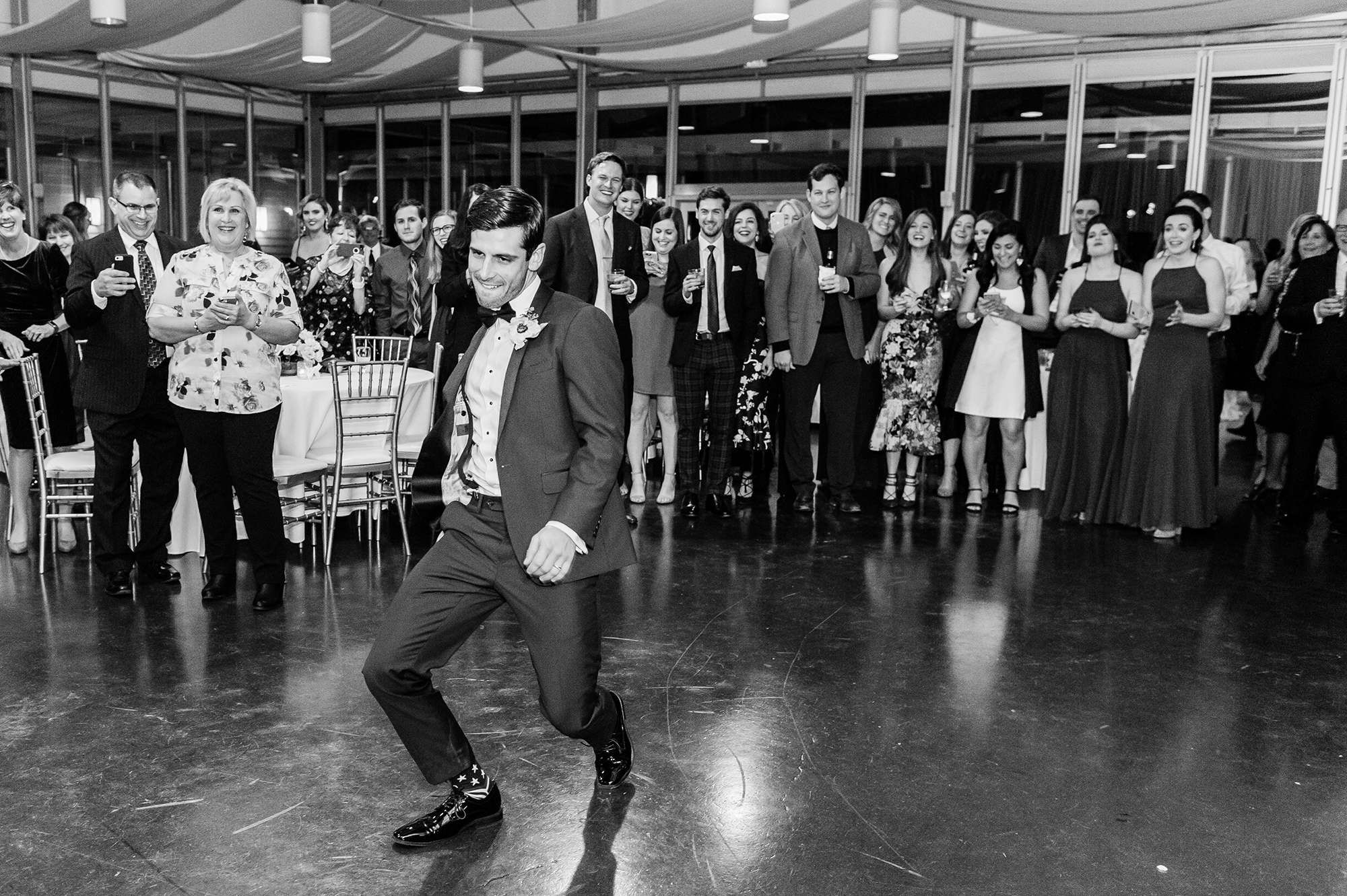 groom dancing during reception