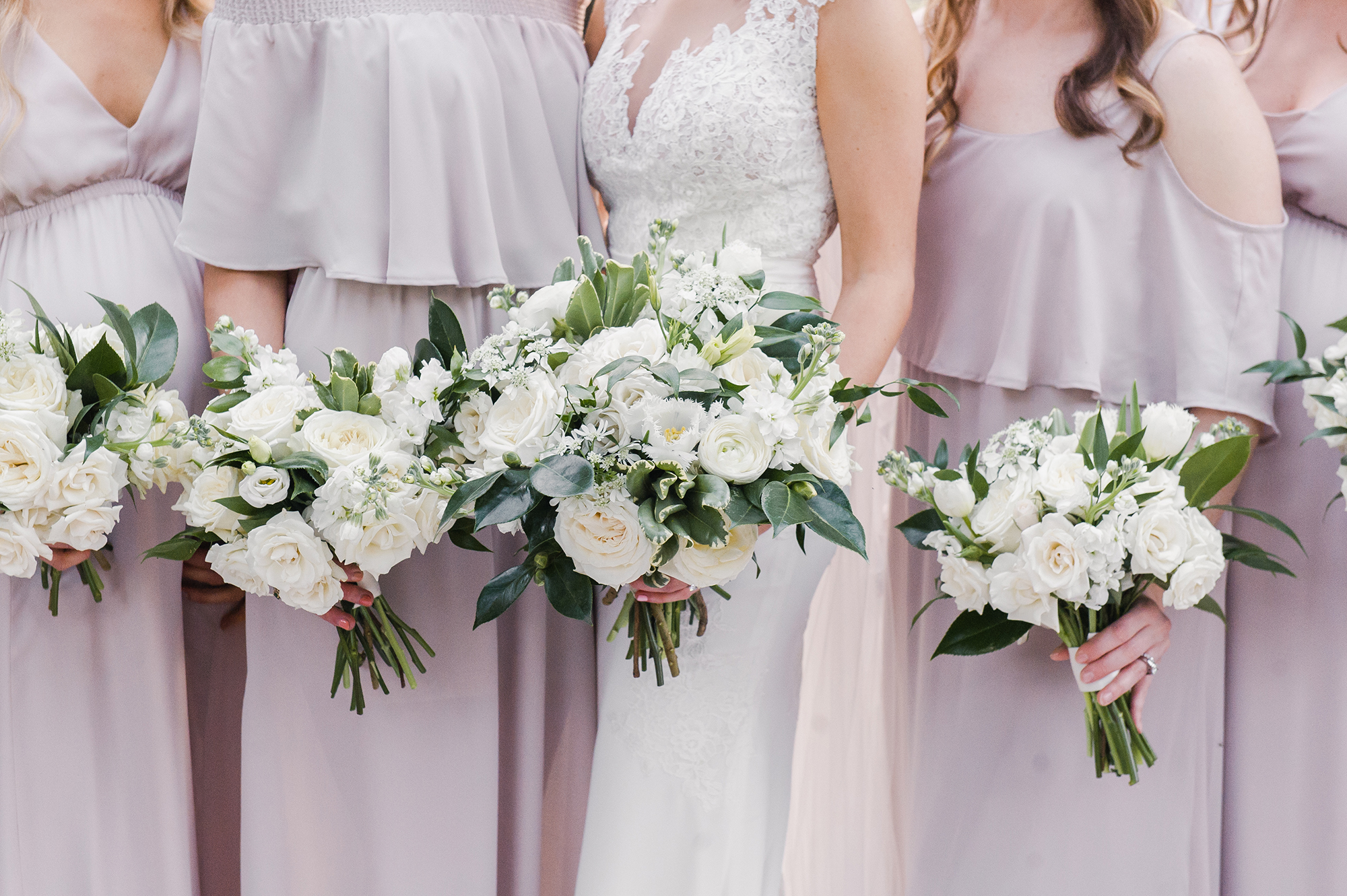 bride with bridesmaids and bouquets