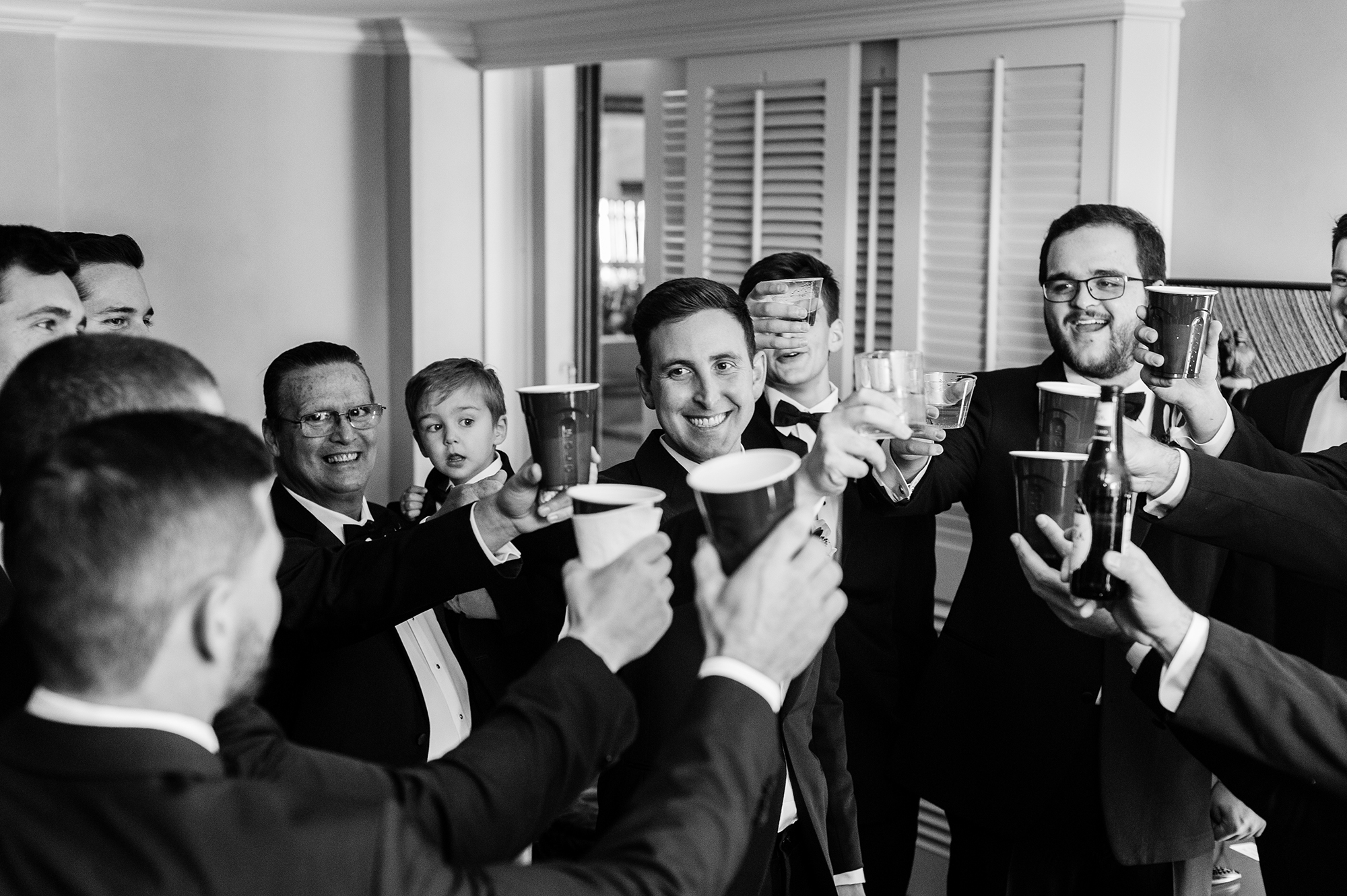 groom toasting with groomsmen