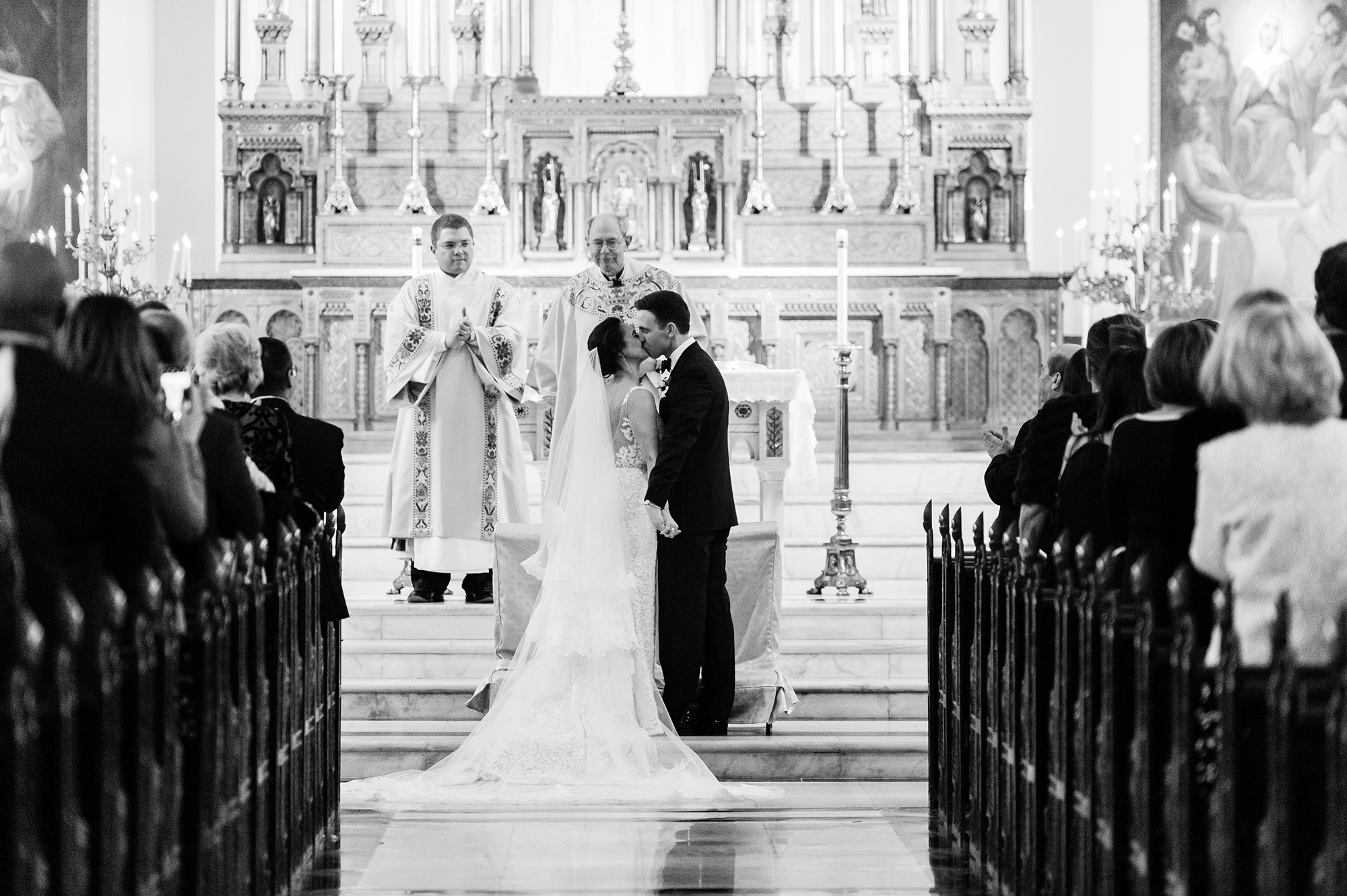 bride and groom at altar in church during ceremony