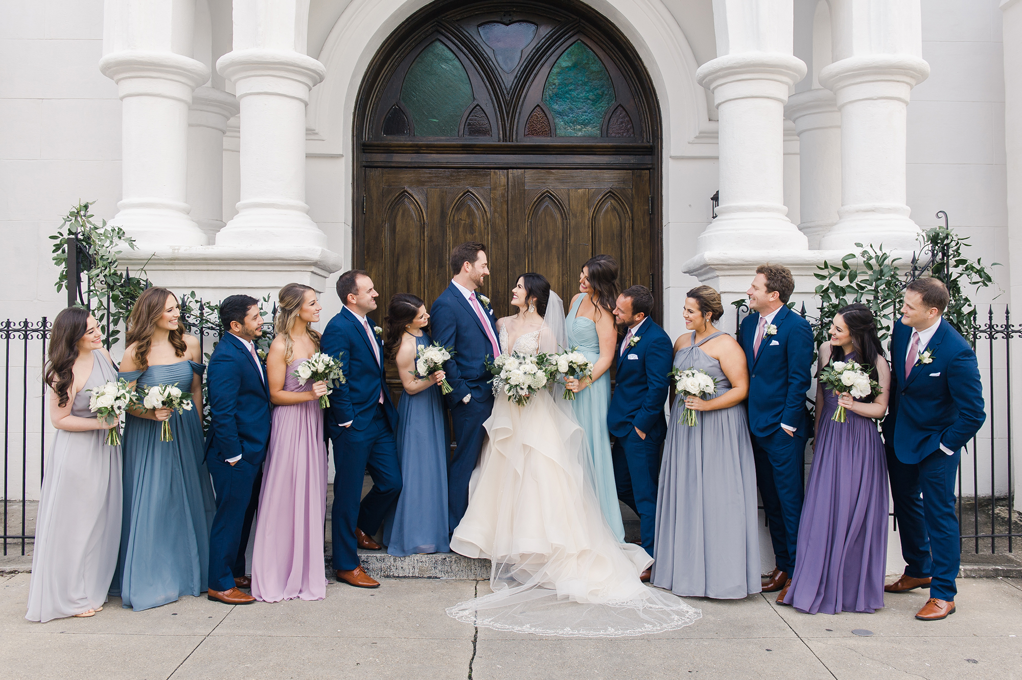 Bride and groom with wedding party outside church