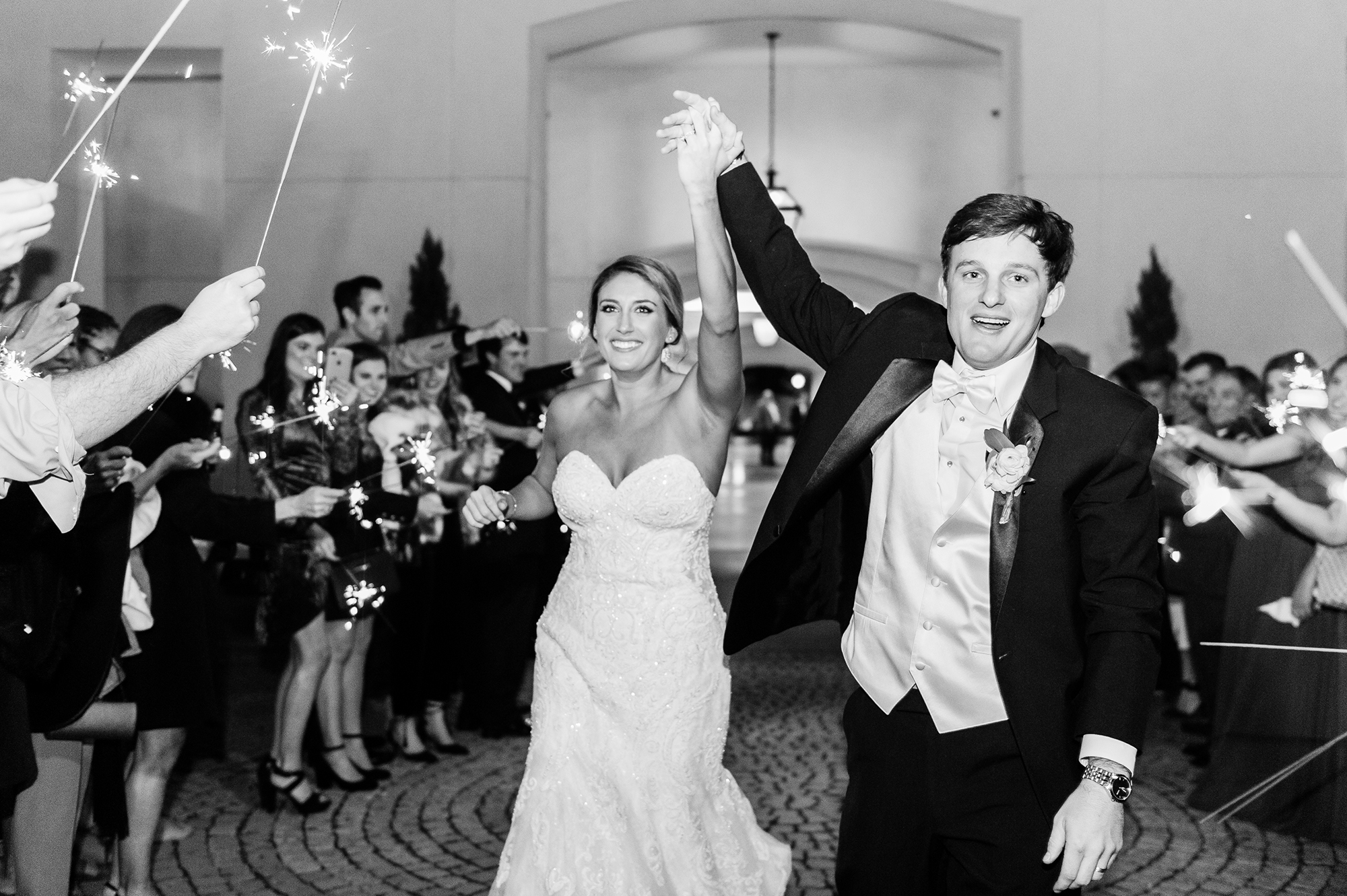 Bride and groom exiting reception with sparklers
